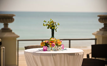 Cocktail Table Overlooking The Ocean Shoreline