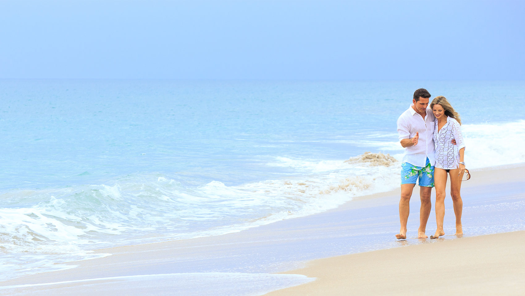 Couple walking on the beach