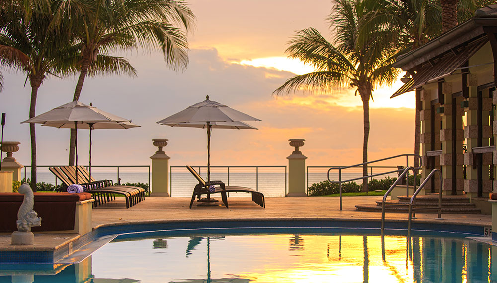 pool overlooking ocean at sunset