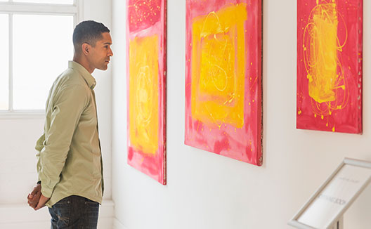 Man looking at artwork